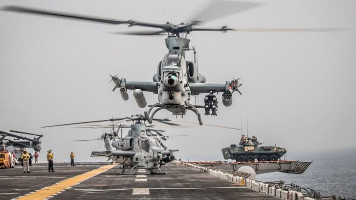 US Marine Corps AH-1Z Viper helicopter flies over the Strait of Hormuz during military operations