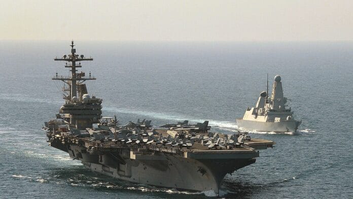 HMS Defender escorts USS George H.W. Bush in the Mediterranean Sea during joint naval operations HMS Defender escorts USS George H.W. Bush in the Mediterranean Sea during joint naval operations