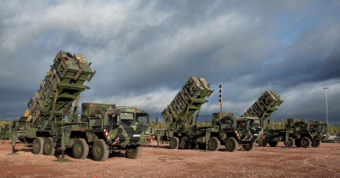 S Patriot missile system launcher with soldiers reloading - MIM-104 Patriot battery