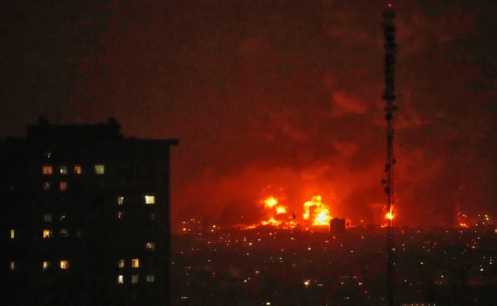 Plumes of smoke rising over Tehran skyline following reported airstrikes during the March 2026 Iran conflict