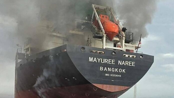 Thailand-flagged bulk carrier Mayuree Naree emitting smoke after being attacked in the Strait of Hormuz, 11 March 2026