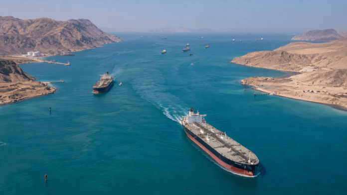 Oil tankers sailing through the Strait of Hormuz, one of the world's most important energy shipping routes.